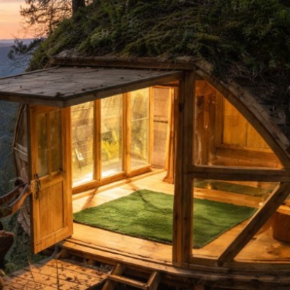 A craftsman transforms discarded pallets into a suspended spherical 